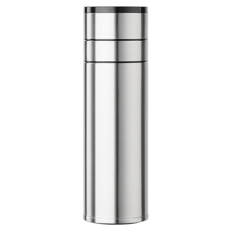 Stainless steel thermos bottle on a white background