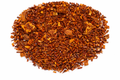 Dried brown leafy substance on a white background