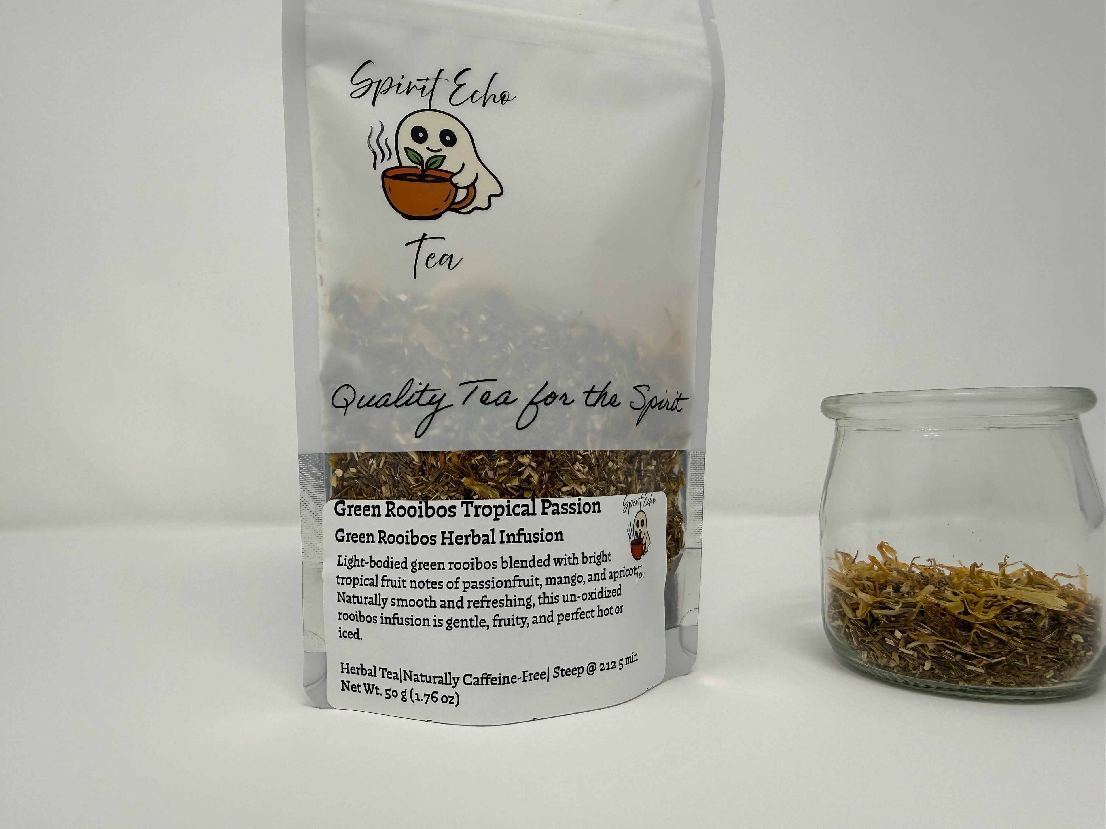 Tea packaging with a clear jar of tea leaves on a white background
