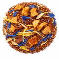 Tea blend with brown leaves, blue flowers, and yellow strands on a white background