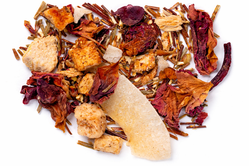 Assorted dried herbs and spices on a white background