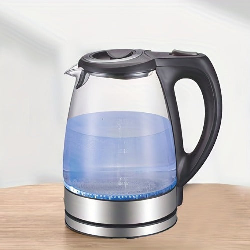 Glass electric kettle with blue light on a wooden surface